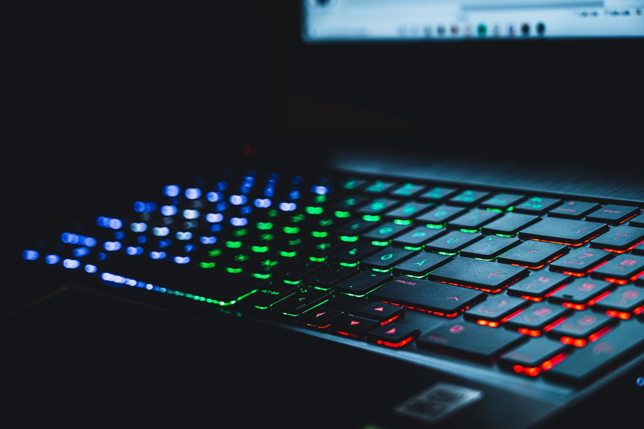 Tigflow | Computer Peripherals Supplier Close-up of a colorful illuminated gaming keyboard with selective focus on the keys.